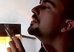 Gay hunk pulls his dick out to masturbate while smoking