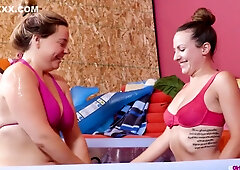 Tattooed Latina Alicia and her spunky pal make out in an inflatable pool on the beach and finger each other's soaked pussies