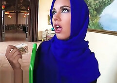 Young Arab woman in hijab accepts cash from boss before mounting him on the office bed