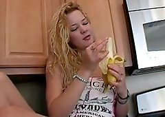 Naughty solo teen slut chewing on a banana