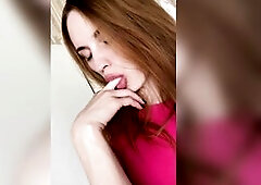 Pretty girl licking her fingers.