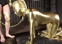 Submissive Asian slut painted in gold makes herself cum hard