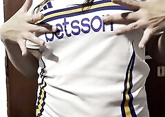 Getting warmed up in advance of the football match... female fan undressing...