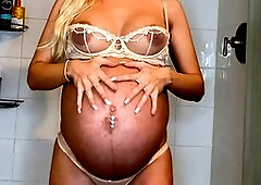 Worshipping the big belly of a pregnant taboo blonde in a steamy JOI session