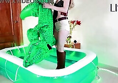 Lissa Brown, safari explorer, inflating an inflatable croc