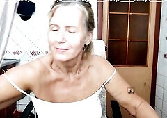 Glad Lukerya, as always, communicates in the kitchen on a cam and flirts with fans, demonstrating bouncing hanging tits that move out of the aid of ha