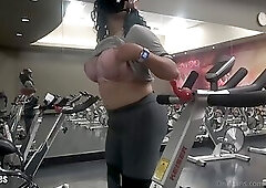 Stroking her big cock in the gym and shooting a cumshot