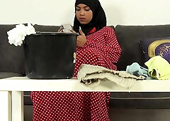 Bushy female in hijab doing extra cleaning
