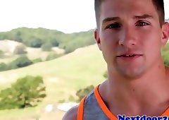 Athletic gay hunk tugs cock in the gym