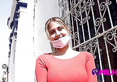 Big titted chick is about to take off her red top, in front of the camera