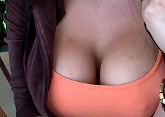 Busty babe playing with her big boobs