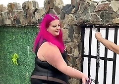 Three merciless mistresses spanking masked slave outdoors