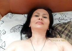 Mature brunette spreads hairy pussy and shows feet for the camera