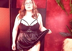 Arya Grander showcases confidence in a mini black dress try-on haul featuring lace and satin