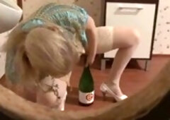 Very horny blonde noticed a dick going out through a gloryhole and decided to fuck it