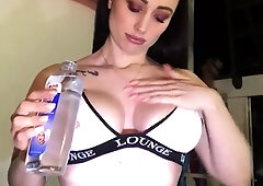 Busty babe playing with her big boobs