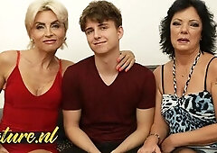 Two Horny Mature Cougars Trick a 21yo Toy Boy Into a Threesome With Them. Watch the full video with these two naughty mature ladies seducing a shy toy