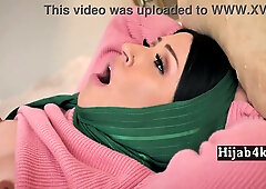 Iranian woman in green hijab shares intimate bedroom moment with tattooed man