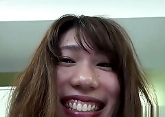 Asian woman spreads her hairy pussy for the camera in intimate solo session