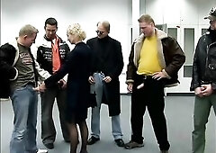 Aged golden-haired in nylons is permeated in all holes