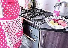 Older sexually excited woman has sex in the kitchen with her stepson during the time that her spouse is watching TV