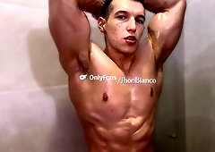 Muscular and flexible hunk gets oiled up for a steamy session