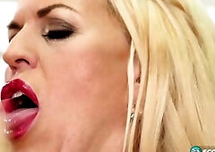 Shannon Blue, a 53-year-old divorcee, mother and grandmother from the UK, screws her boobs and snatch with a monster sextoy that's well over a fo