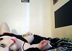 emo cutie smokes a cigarette, positions, and shows her feet