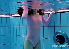 Flexible chick, Roxalana Cheh is wearing a sheer costume while playing in the swimming pool