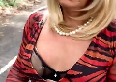 Naughty crossdresser Kellycd2022 enjoys a seductive stroll in the streets in sexy black tights and boots