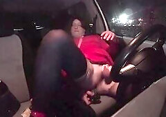 Sissy plays with it's sex tool in the car of a parking lot.