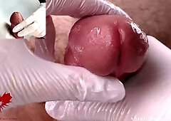 Nurse in white latex gloves gives a firm handjob during a medical examination