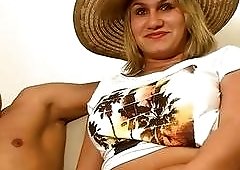 Blond shemale gets her titties sucked on by horny hunk