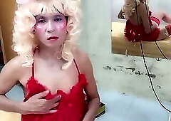 Oanh Le transgender wearing suggestive clothes to play with cans pretending to be too happy
