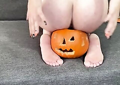 Forget candy—this is the real Halloween treat. I’m totally bare, sitting exposed on top of a carved hollow pumpkin, my booty sealed perfectly agai
