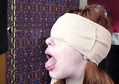 Blindfolded redhead slavegirl gagging cock