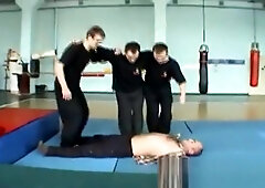 Three martial artists trampling at dojo