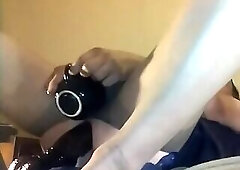 On my back and a big black dildo pounding that ass