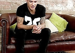 Inked blonde jock strips during an interview and jerks off