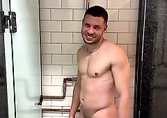 Well-endowed men playing around in the gym bathroom.