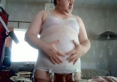 Milky guy in girdles and a bra enjoys some solo action