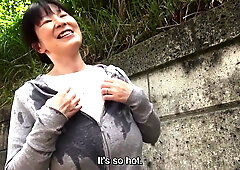 Sweaty older Japanese woman with massive tits uses them on my feet