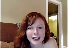 Small titteed redhead is taking off her clothes in front of the camera, for the first time