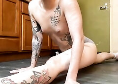 Of Undressed Ballerina stretching of her hamdstrings.