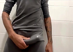 Thin fellow with a fat sausage milking off until he spunks in the work douche.