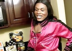 Ebony shebabe in sexy fishnets toys and sucks long cucumber