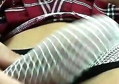 Appealing babe lifts her skirt up and  shows her dick