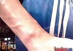 Busty and hot shemale Nicol masturbates on a balcony