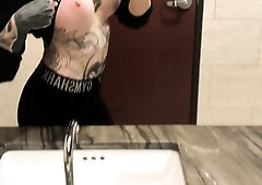 Tattooed teen reveals her fabulous body in a public toilet