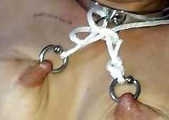 Her nipples are all chained up by her horny master